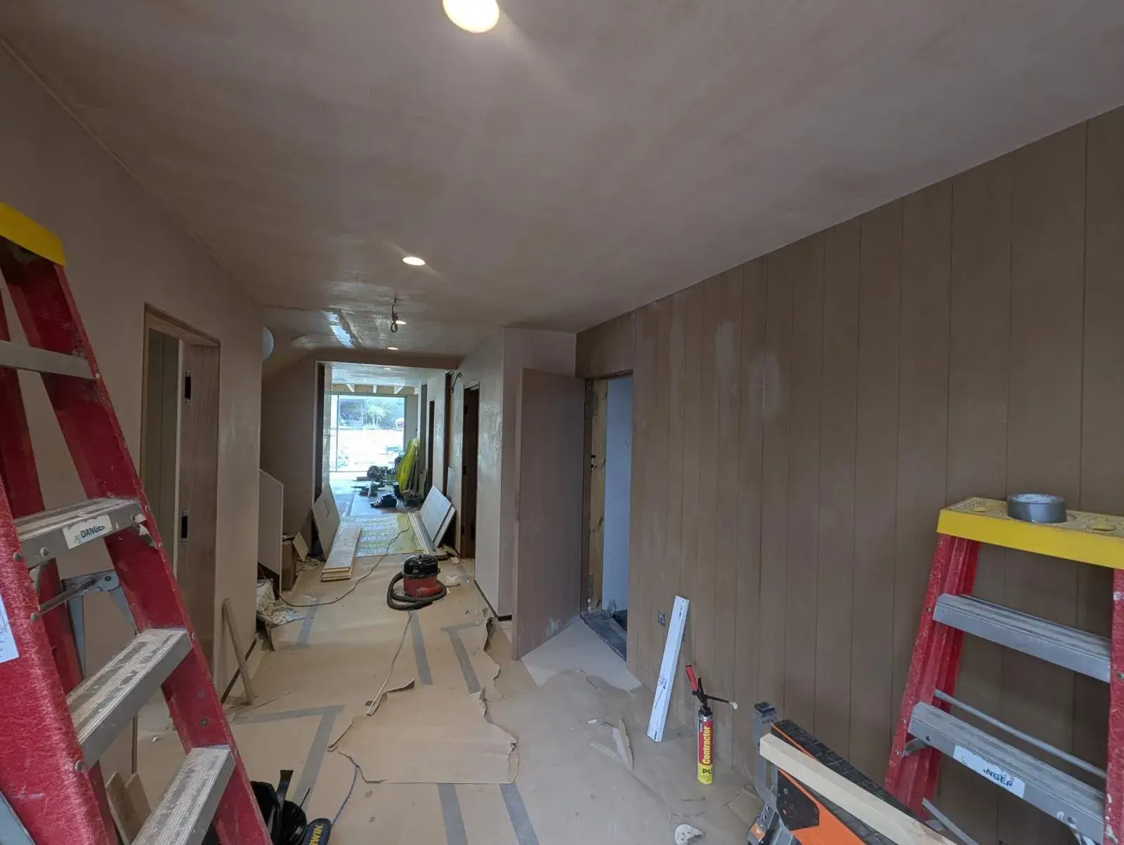 The Pearl Plastering team mid-skim on a Dorset hallway renovation