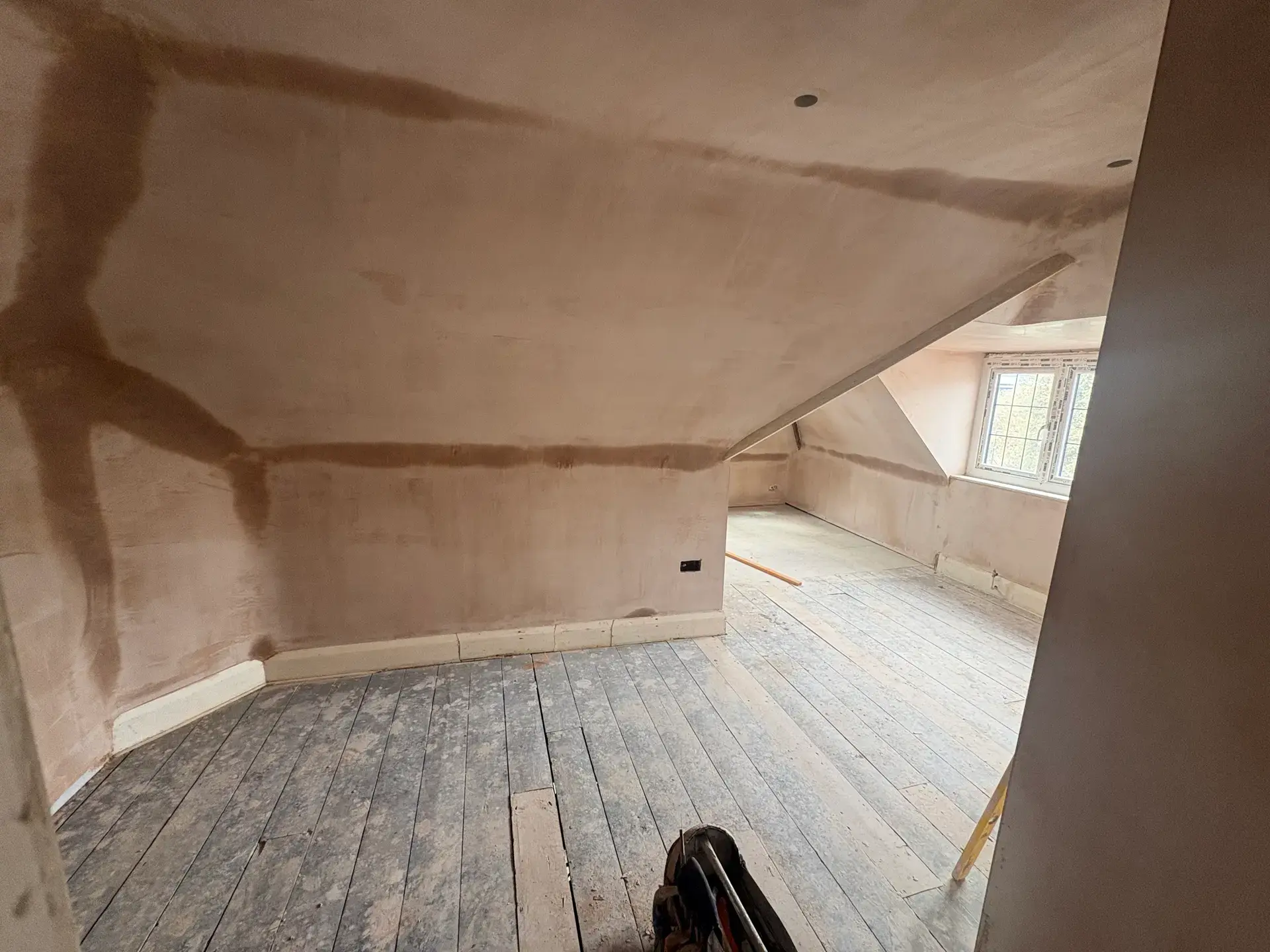 A Pearl-plastered loft conversion ready for the decorator on a Dorset builder programme